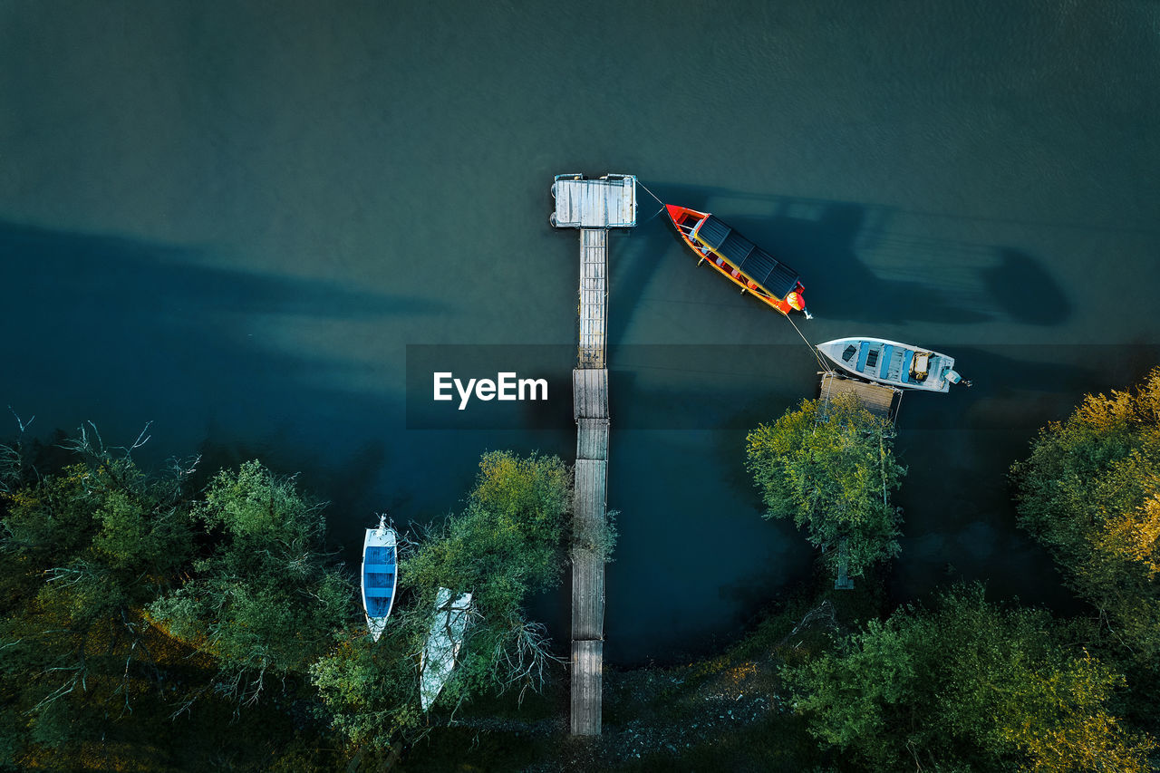 Aerial view of fishing boat by pier