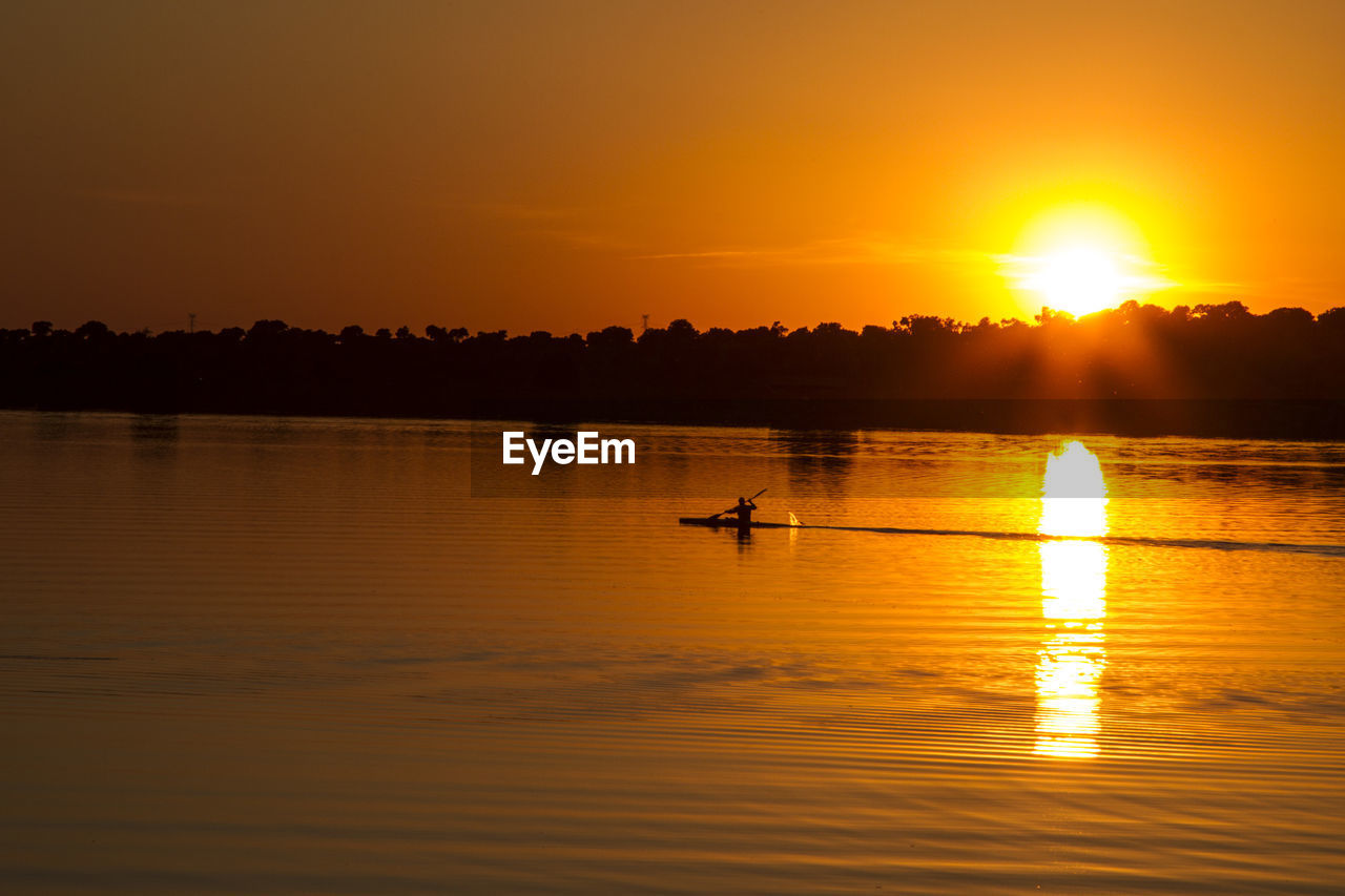 SCENIC VIEW OF LAKE DURING SUNSET