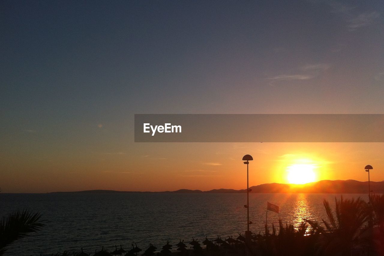 SCENIC VIEW OF SEA DURING SUNSET