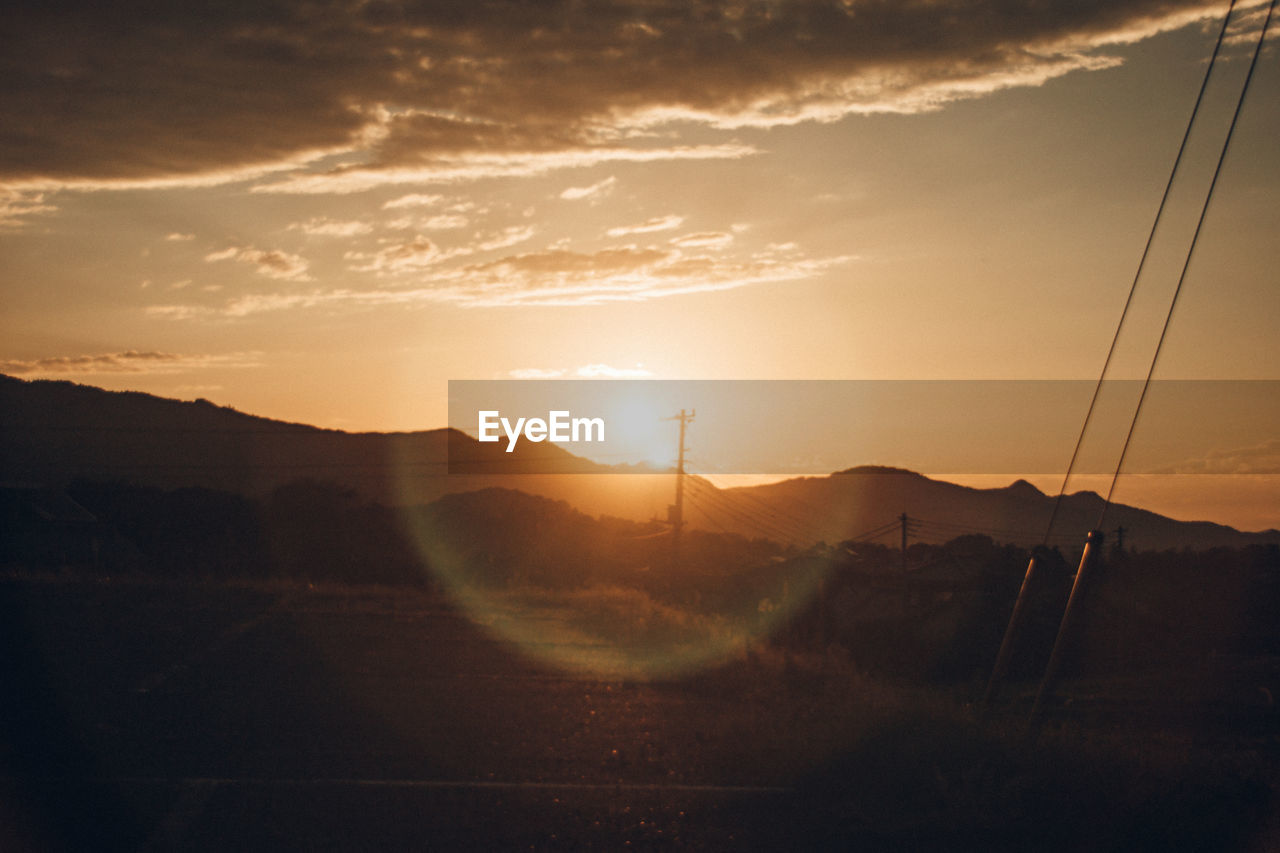 Scenic view of mountains against sky during sunset