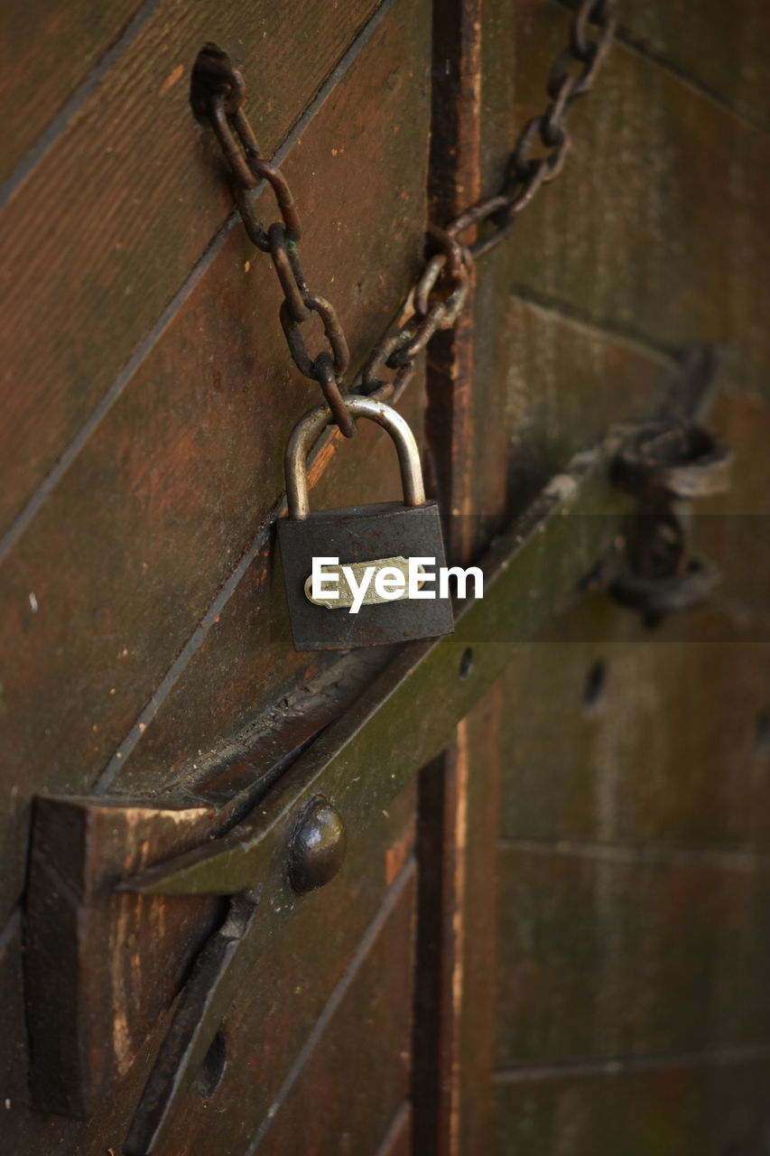 CLOSE-UP OF PADLOCKS ON DOOR