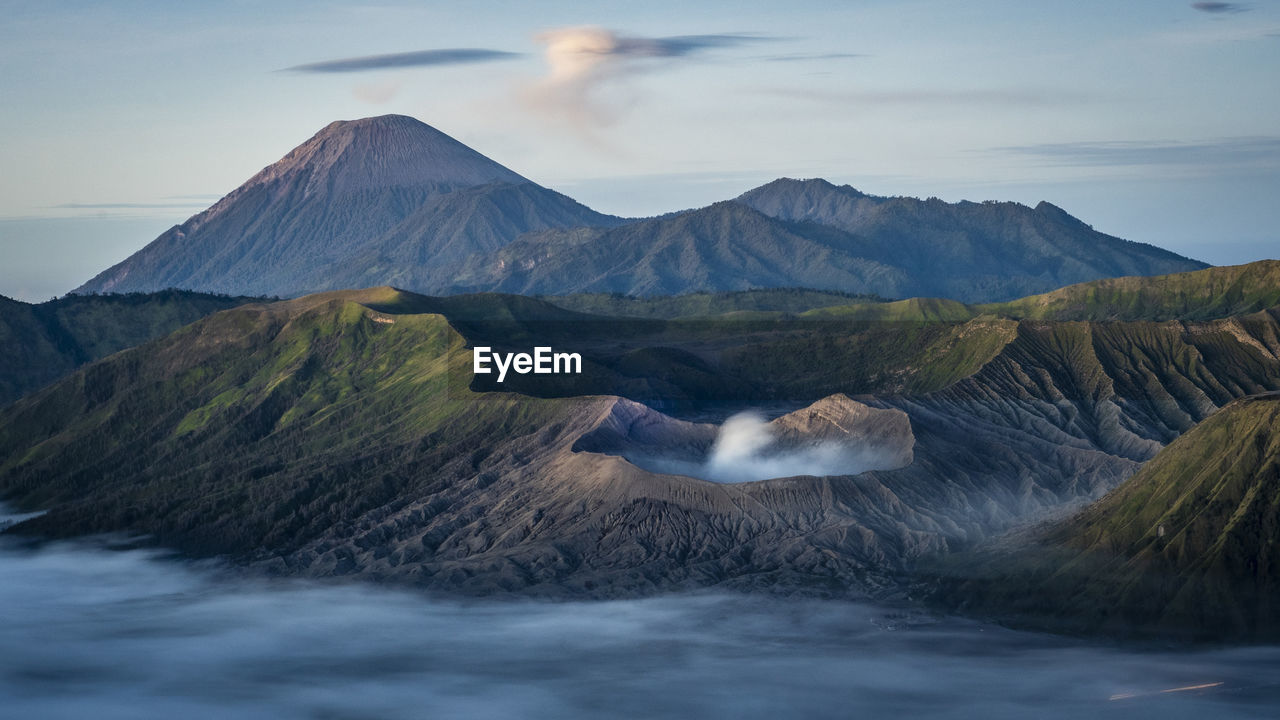 Scenic view of mountains with fog at bromo tengger semeru national park, indonesia