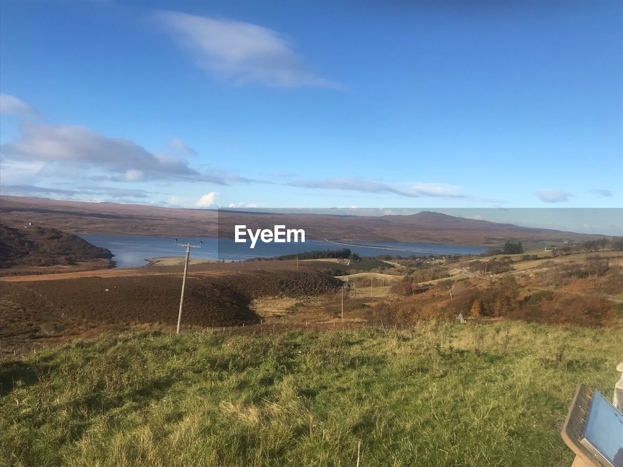 SCENIC VIEW OF FIELD AGAINST BLUE SKY