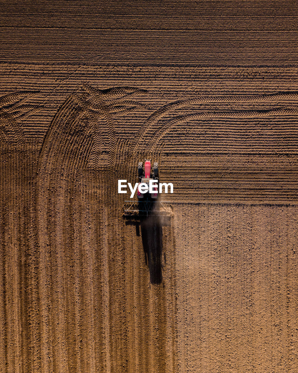 Aerial view of tractor on agricultural land