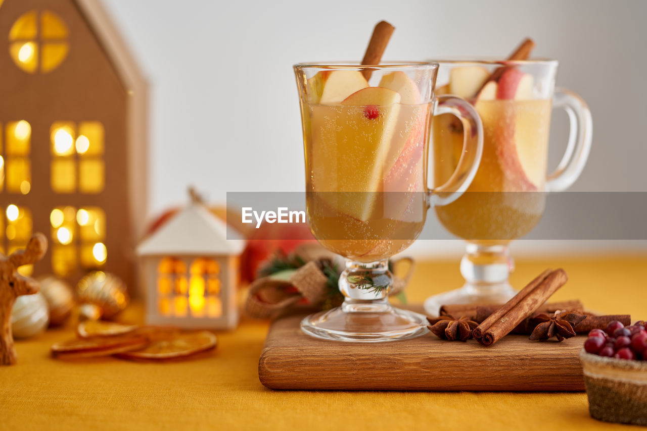 Two glasses of hot christmas winter apple gluhwein. alcohol white mulled wine. apple cider