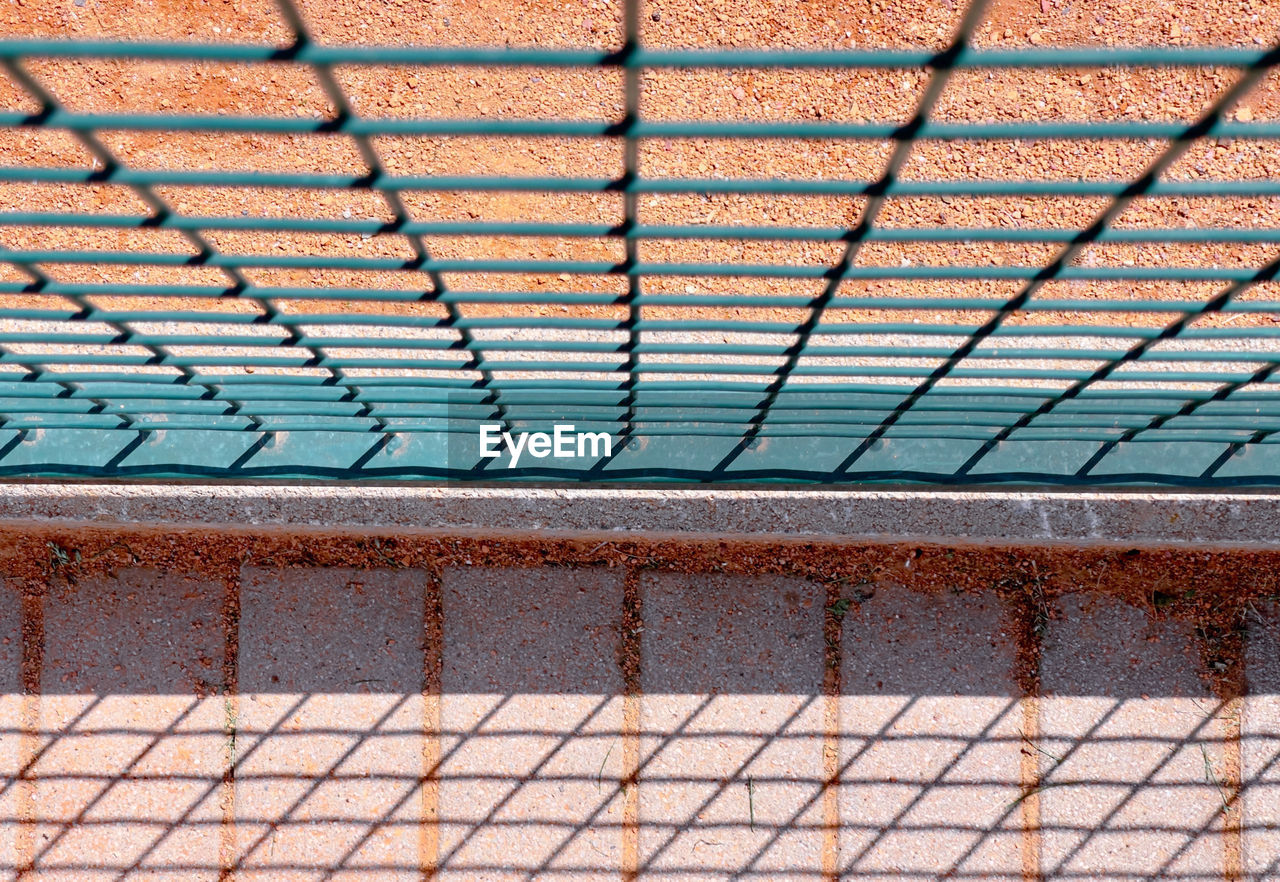 pattern, wall, no people, net, day, metal, architecture, built structure, line, roof, brick, chain-link fencing, full frame, backgrounds, security, outdoors, fence, protection, sunlight, iron, wood, flooring, chainlink fence, textured, outdoor structure, nature, close-up, mesh, floor