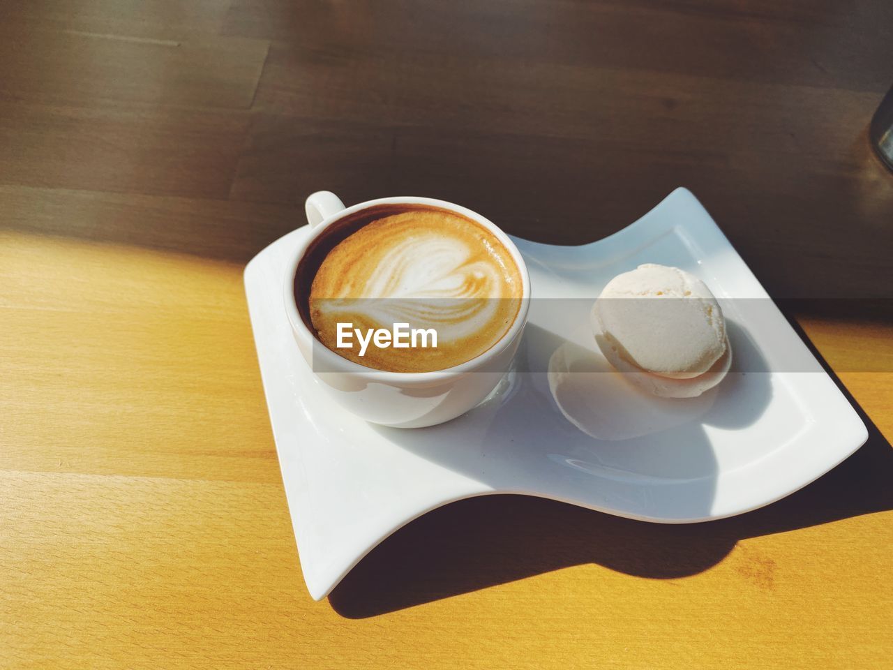 HIGH ANGLE VIEW OF COFFEE ON TABLE AT HOME