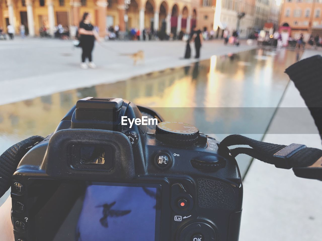 CLOSE-UP OF CAMERA AGAINST WATER