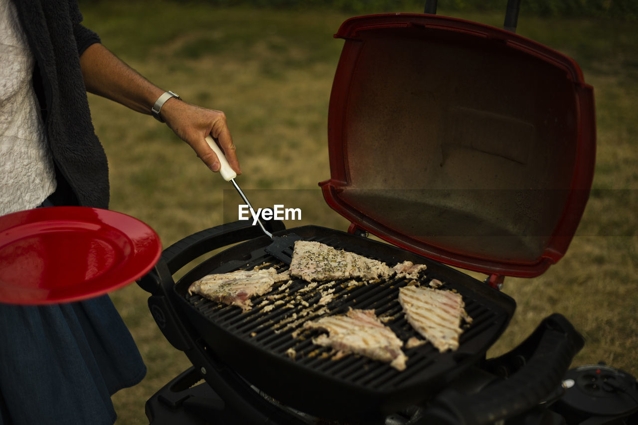 Close-up of meat on barbecue grill