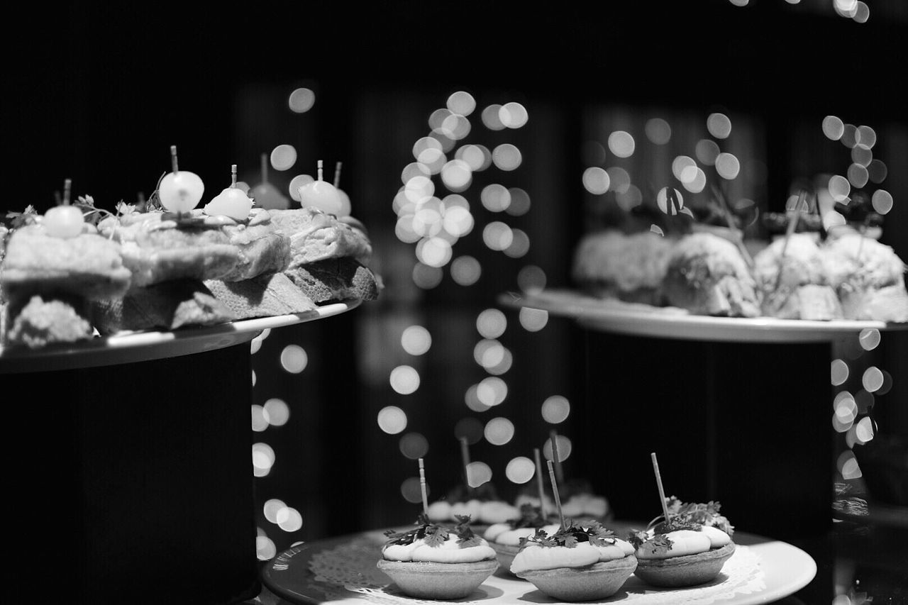 CLOSE-UP OF ICE CREAM ON TABLE AT NIGHT