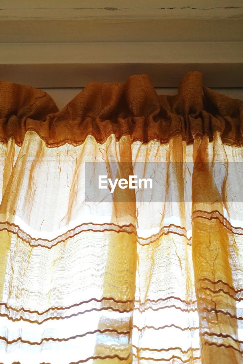 CLOSE-UP OF CLOTHES DRYING HANGING ON CLOTHESLINE