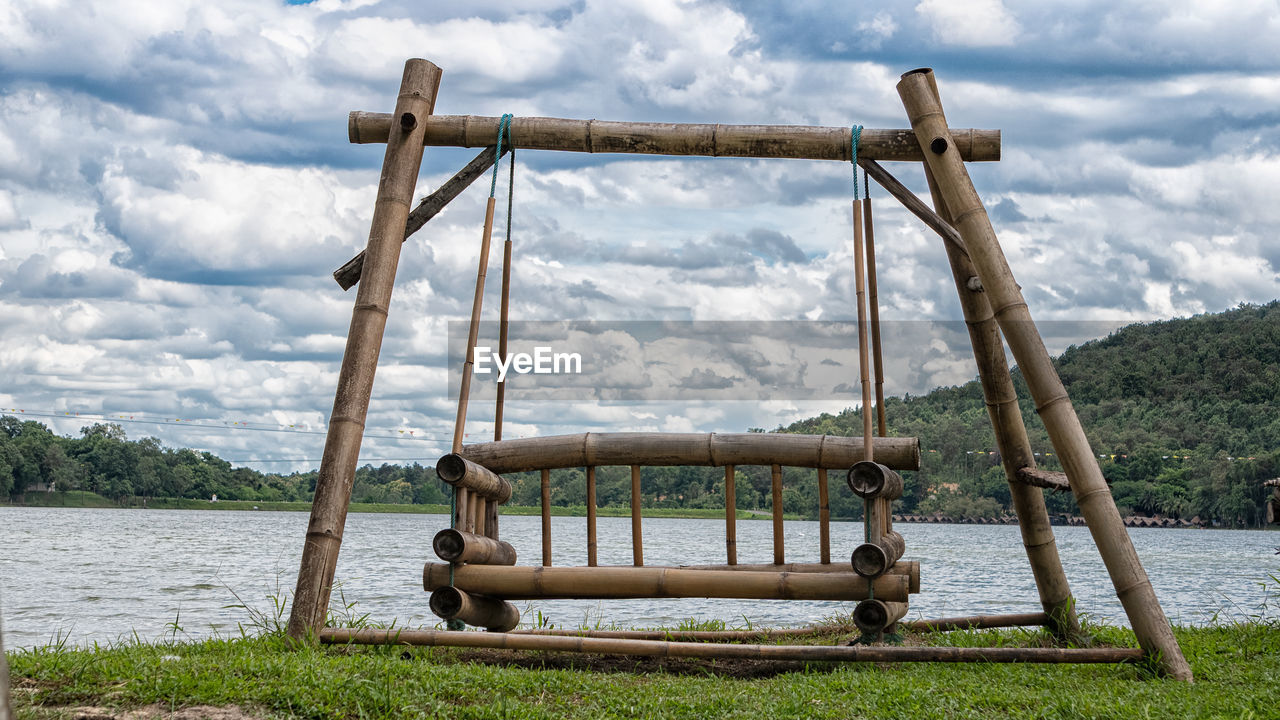 SWING ON PLAYGROUND AGAINST SKY