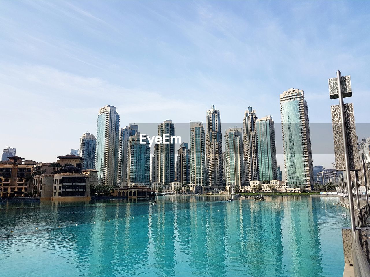 water, city, building exterior, architecture, built structure, sky, office building exterior, waterfront, skyscraper, building, tall - high, urban skyline, cityscape, modern, landscape, nature, day, office, no people, outdoors, financial district, swimming pool