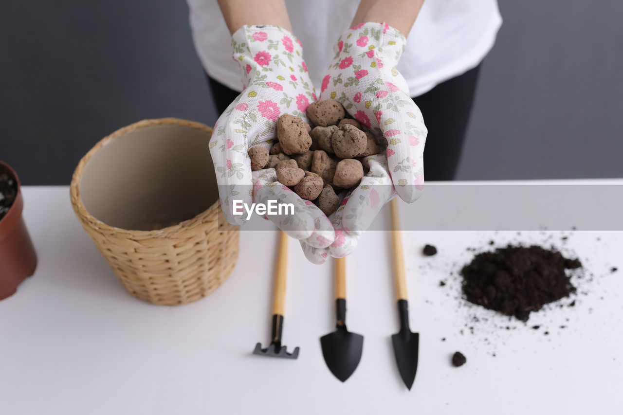 high angle view of hand holding food on table