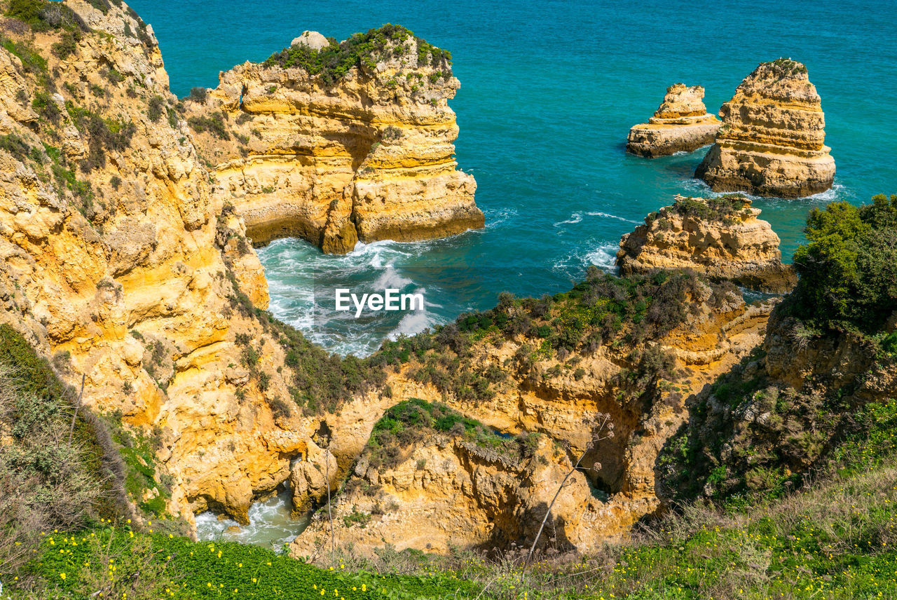 High angle view of rocks at sea shore