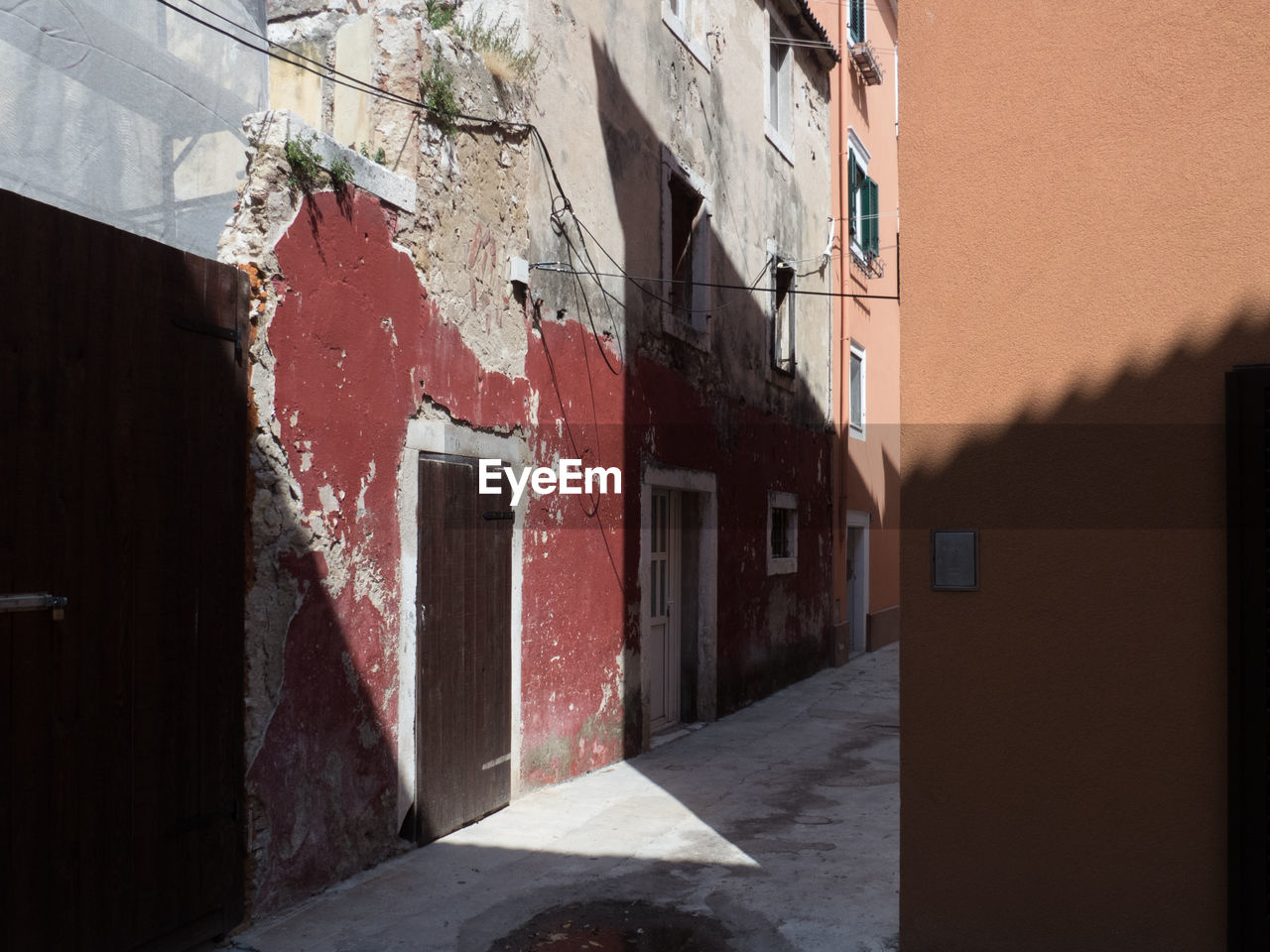 NARROW LANE ALONG BUILDINGS