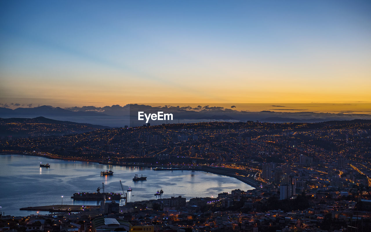Sunset over the bay and town of valparaiso in chile