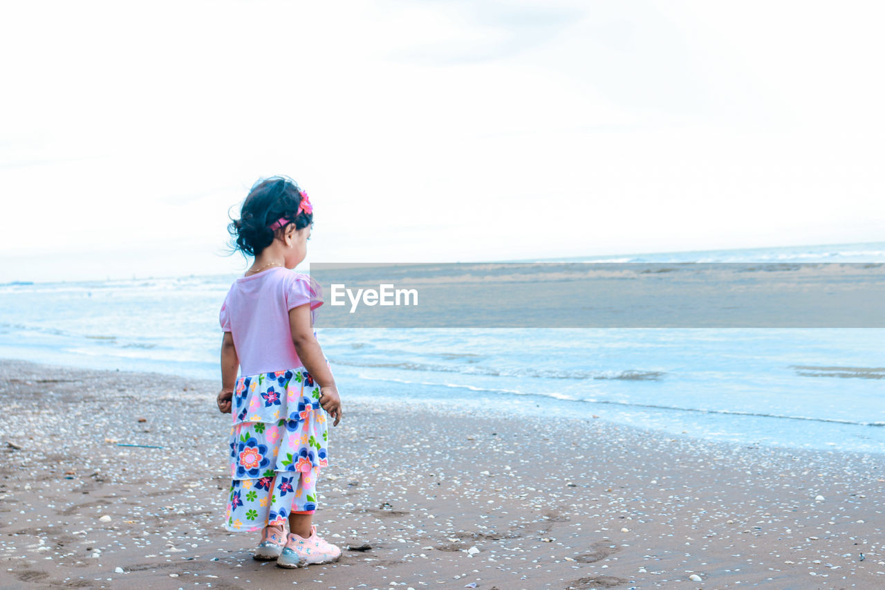 Little girl by the beach