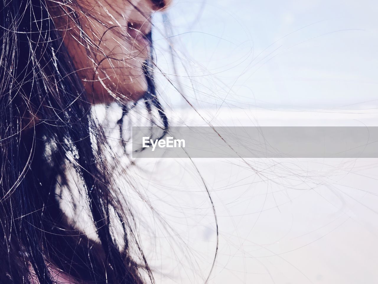 Cropped image of woman at beach