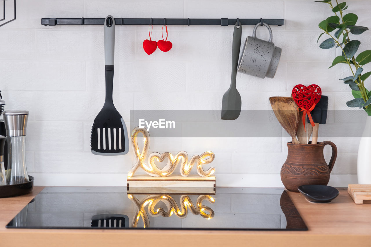 close-up of kitchen utensils on table at home