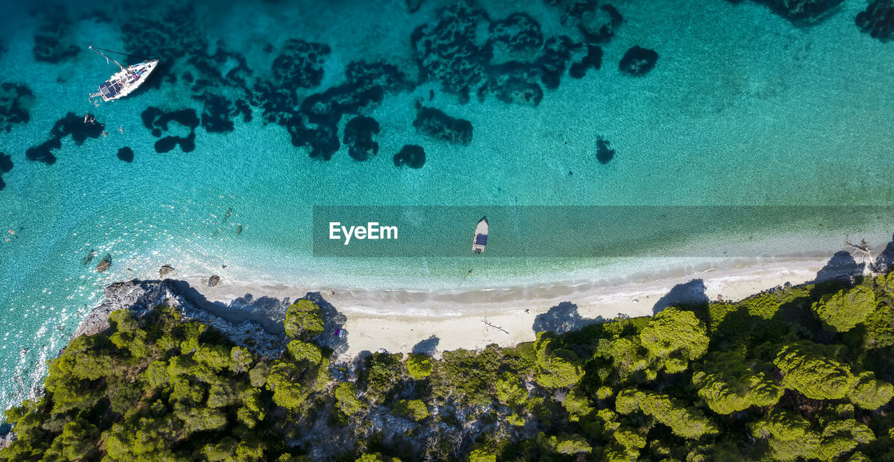 high angle view of people swimming in sea