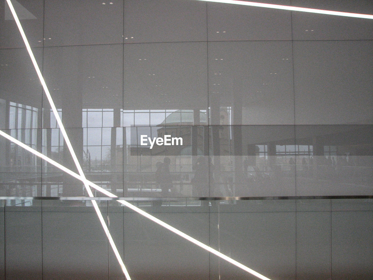 REFLECTION OF BUILDING IN GLASS