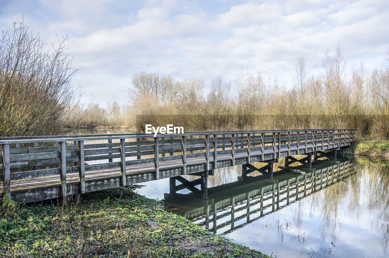 Wooden pedestrian bridge in a nature reserve near deventer, the netherlands