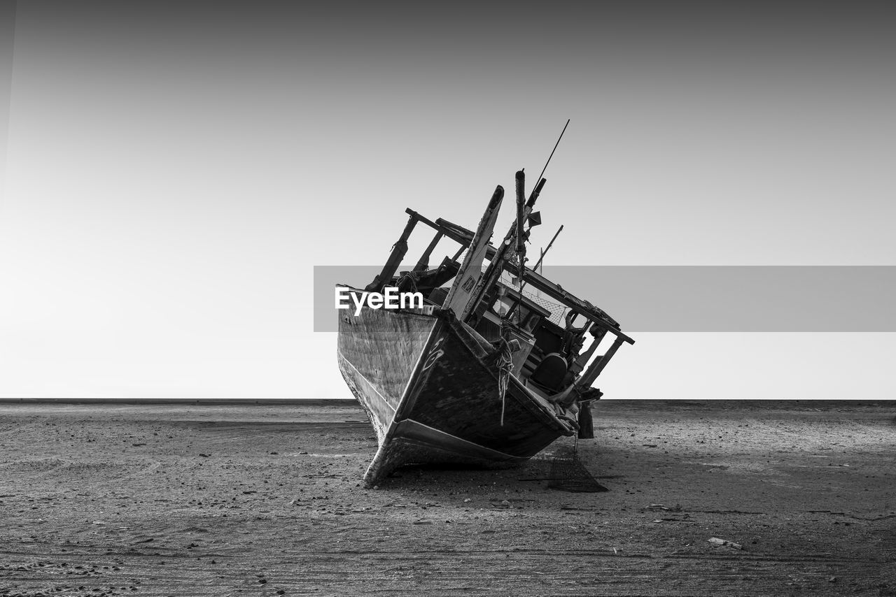 black and white, water, sea, vehicle, monochrome photography, nautical vessel, abandoned, shipwreck, damaged, transportation, monochrome, boat, sinking, ship, broken, nature, sky, beach, ruined, decline, mode of transportation, deterioration, land, destruction, no people, watercraft, misfortune, accidents and disasters, rundown, day, copy space, outdoors, horizon, bad condition, horizon over water, ocean, sand, white