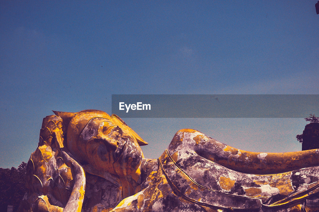 PANORAMIC VIEW OF ROCKS AGAINST SKY