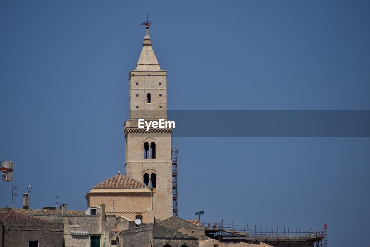 Low angle view of church against clear blue sky