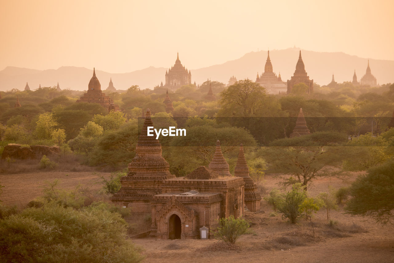 Old ruins of temples against clear sky