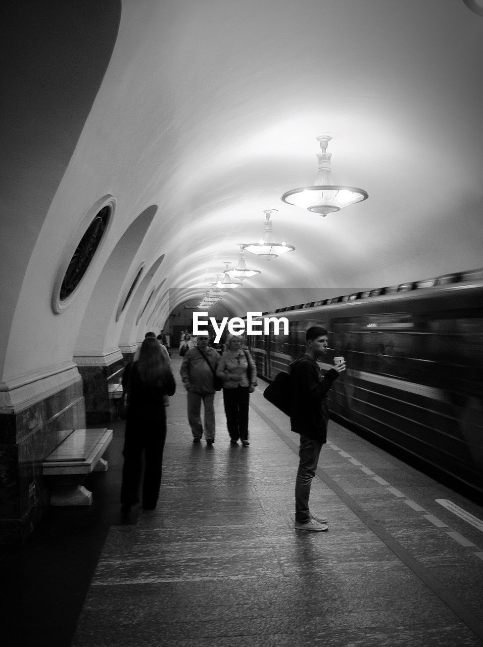 HIGH ANGLE VIEW OF PEOPLE IN ILLUMINATED UNDERGROUND