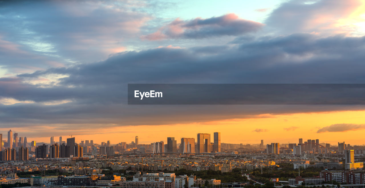 Cityscape against sky during sunrise 