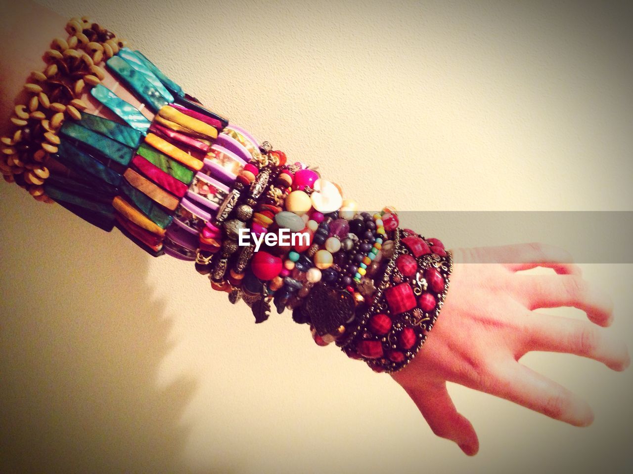 Close-up of hand wearing colorful bracelets