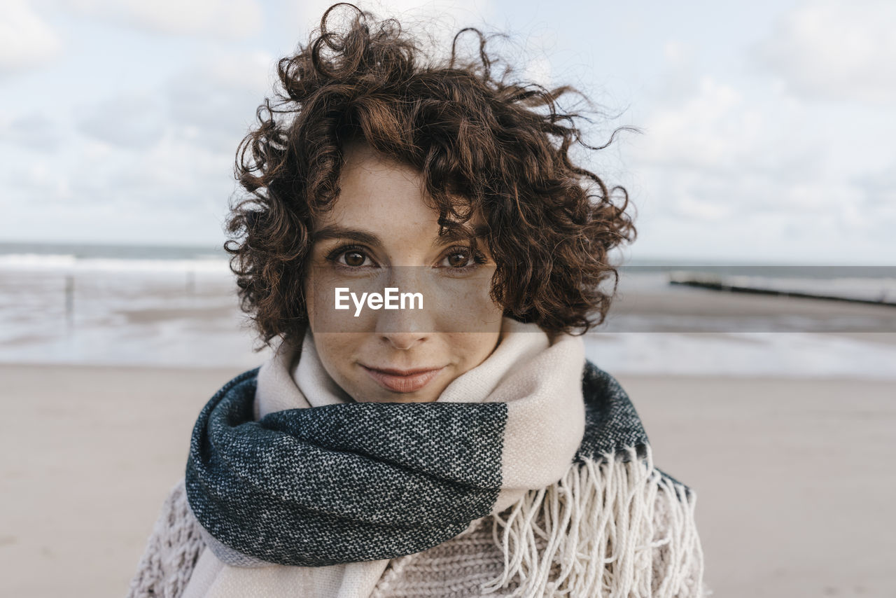 Portrait of smiling woman on the beach