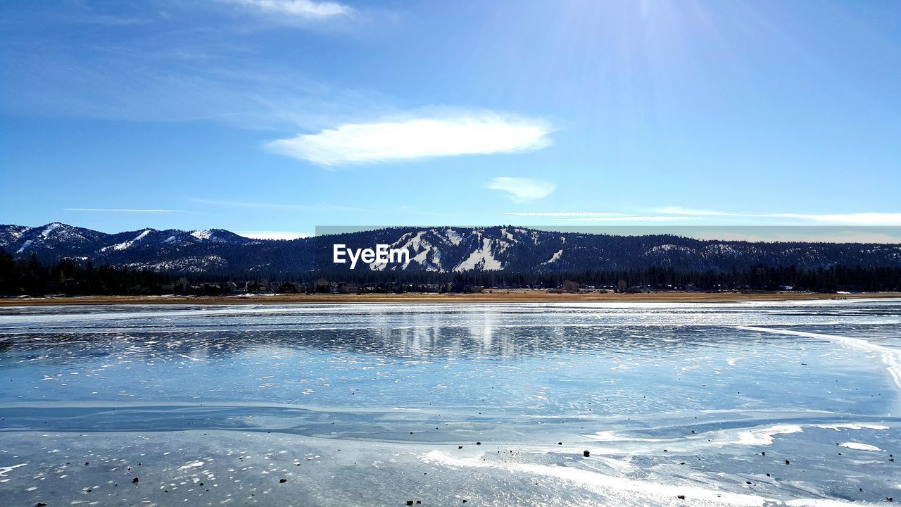 Scenic view of frozen lake against sky