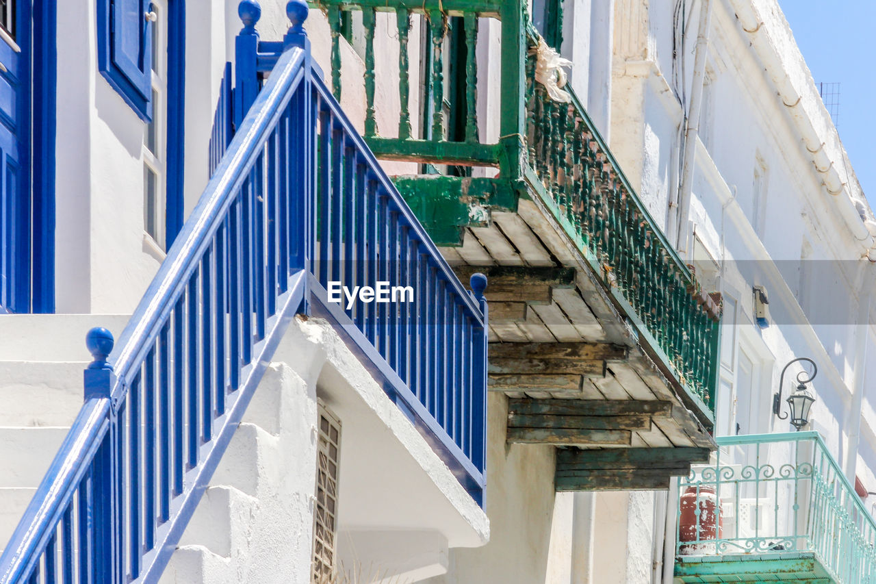 Low angle view of staircase amidst buildings in city