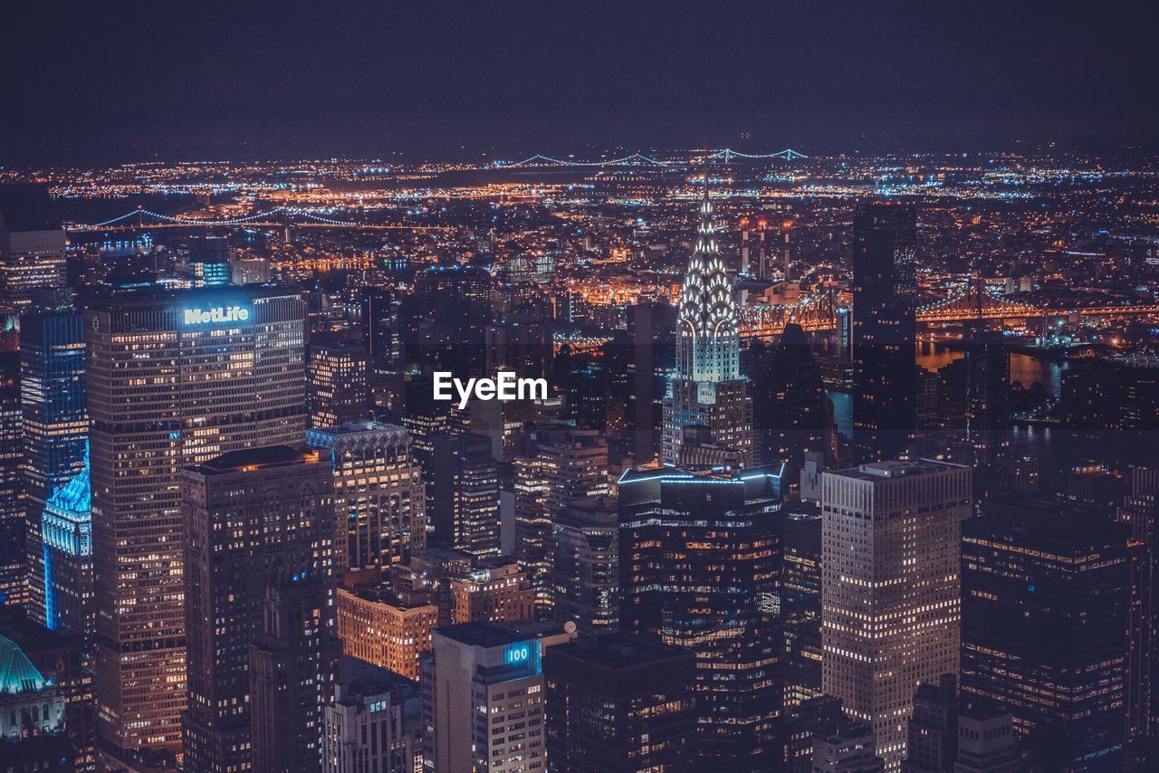 Aerial view of chrysler building amidst cityscape at night