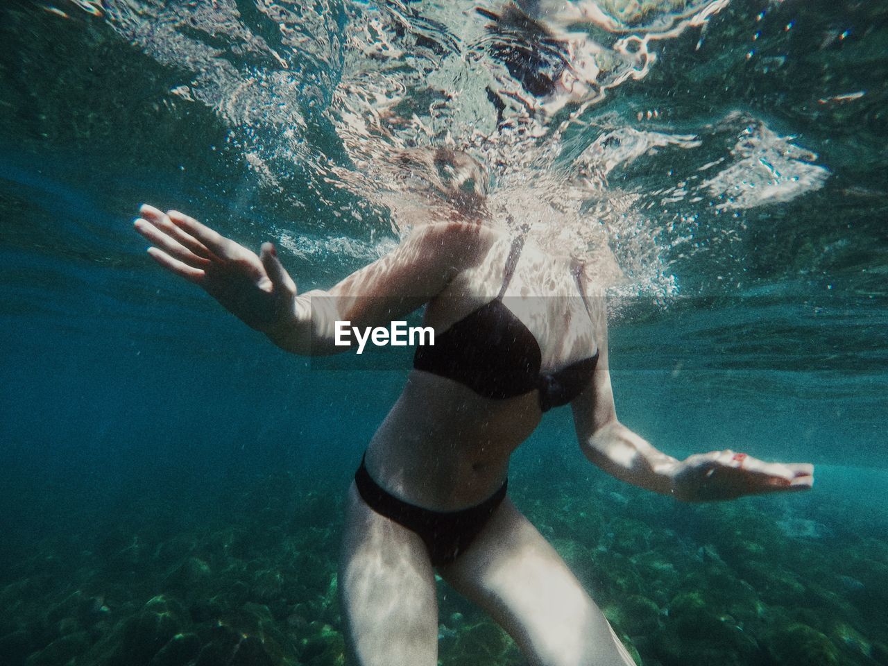 MAN SWIMMING IN POOL