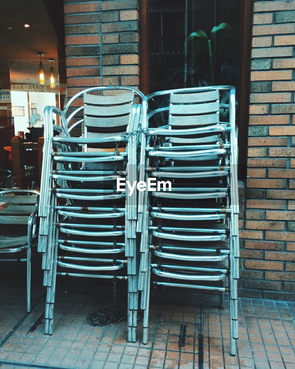 Chairs stacked against wall in restaurant