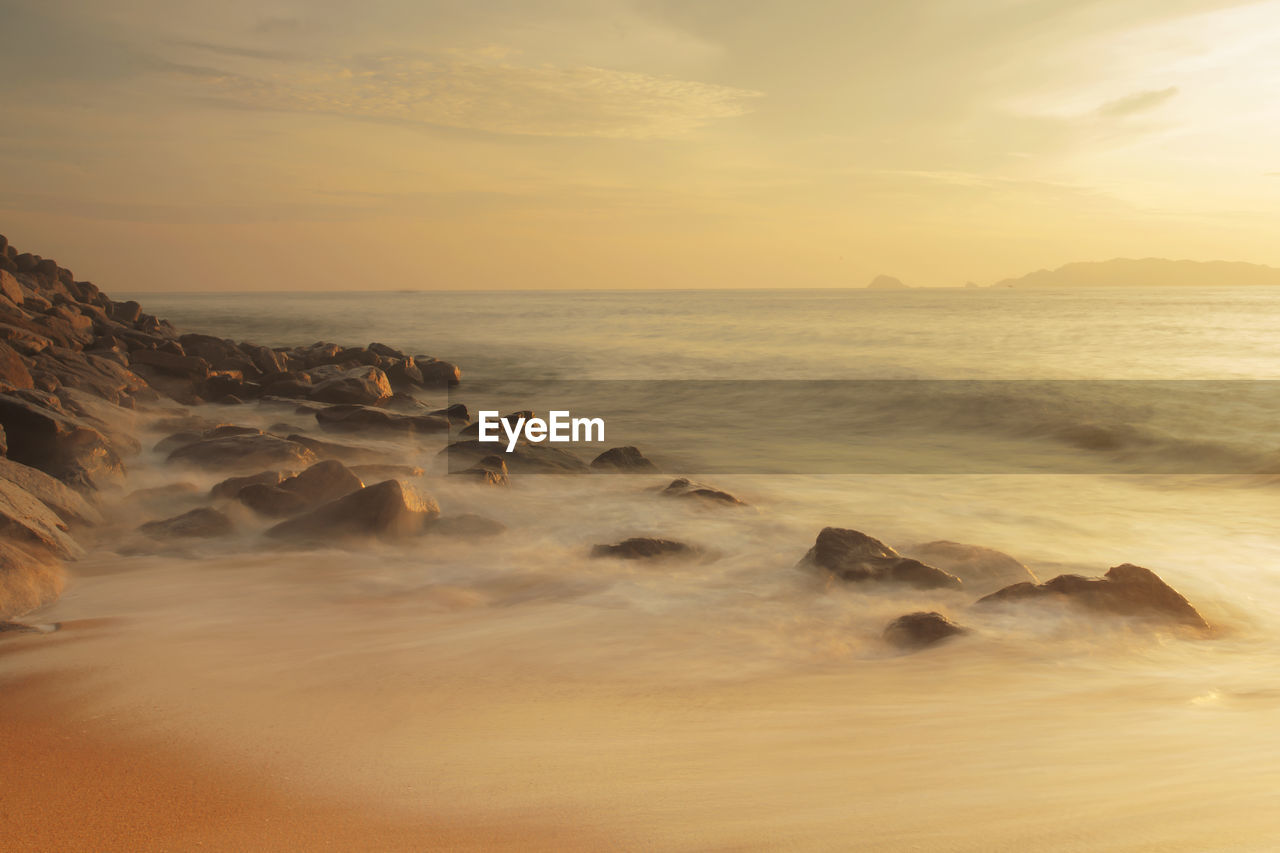 View of beach at sunset