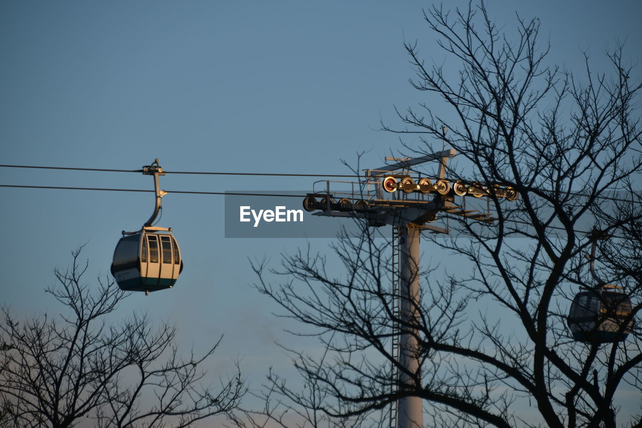 Low angle view of cable car against clear sky