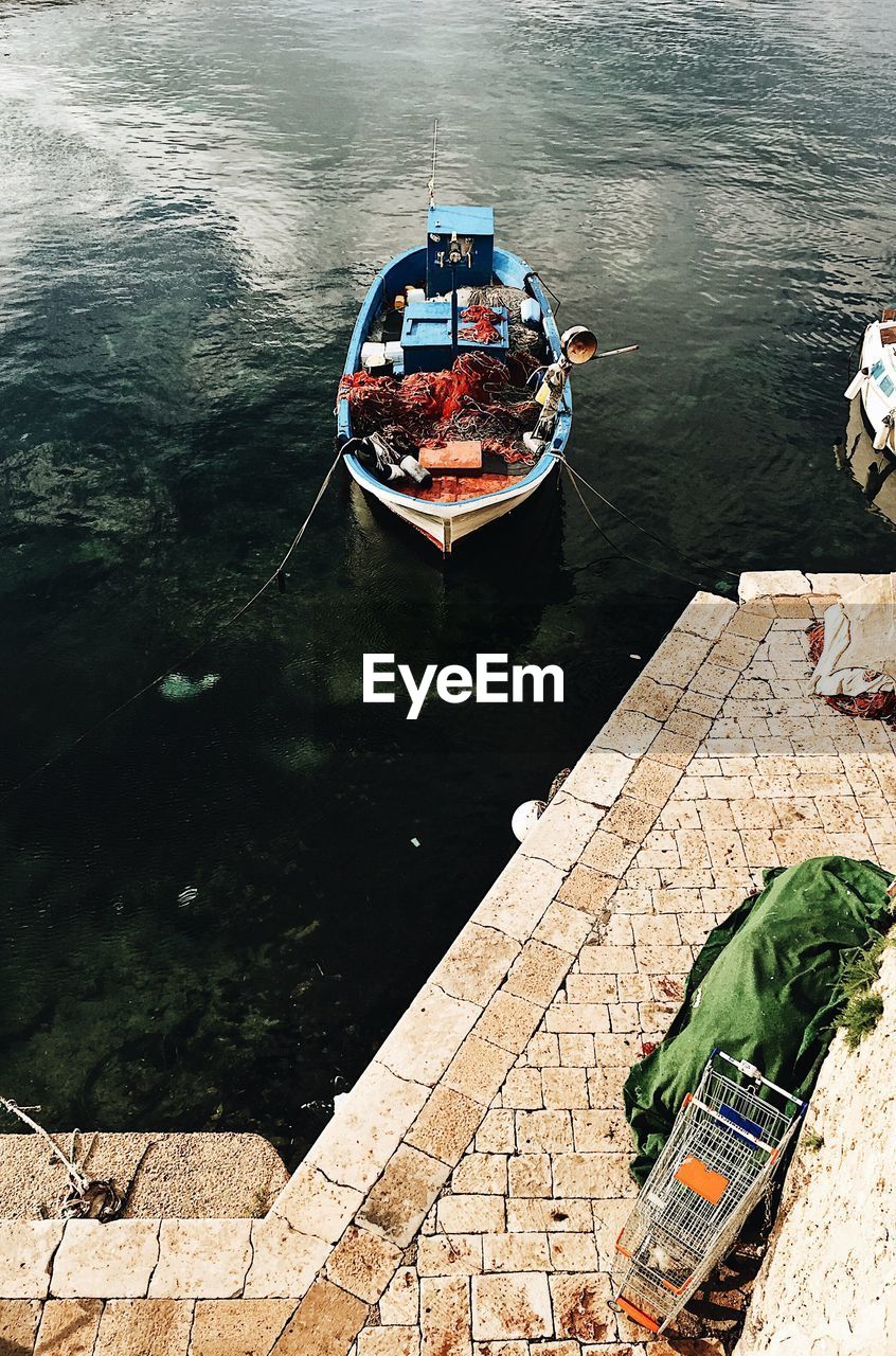 High angle view of boat moored in water