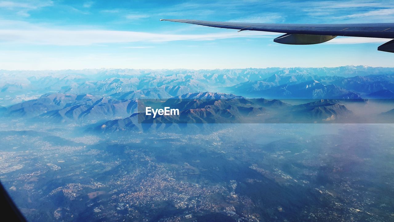 Aerial view of landscape and mountains against sky