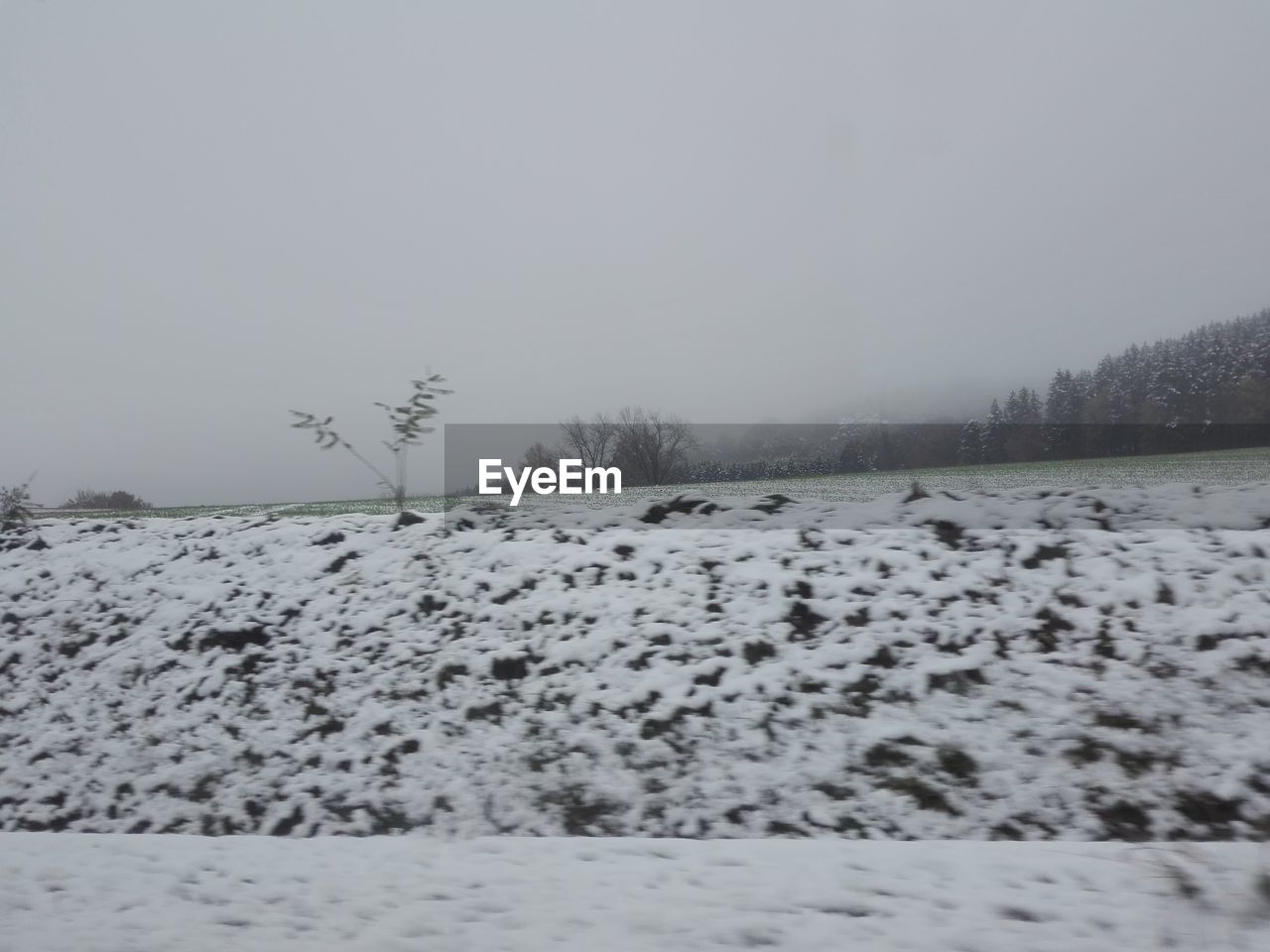 SNOW COVERED LAND AGAINST SKY