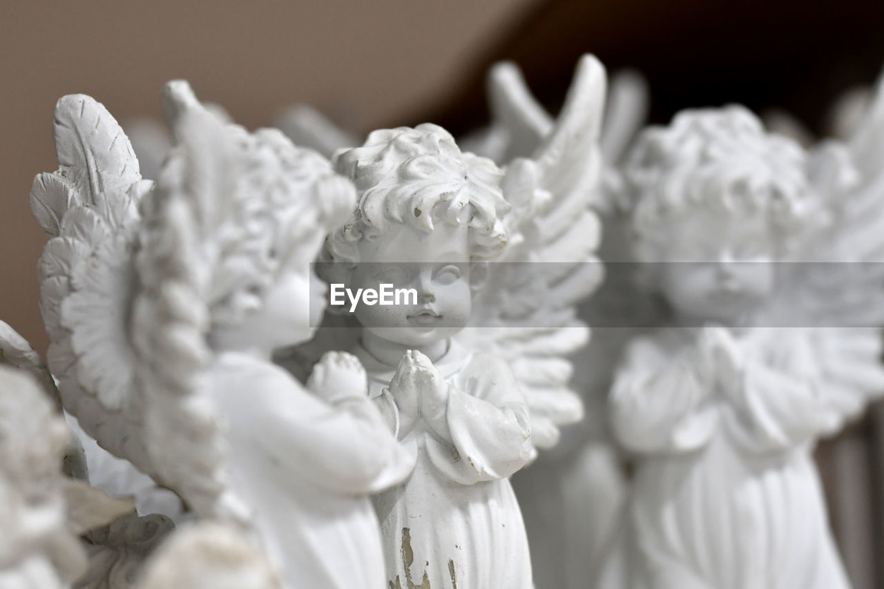Close-up of angel statues