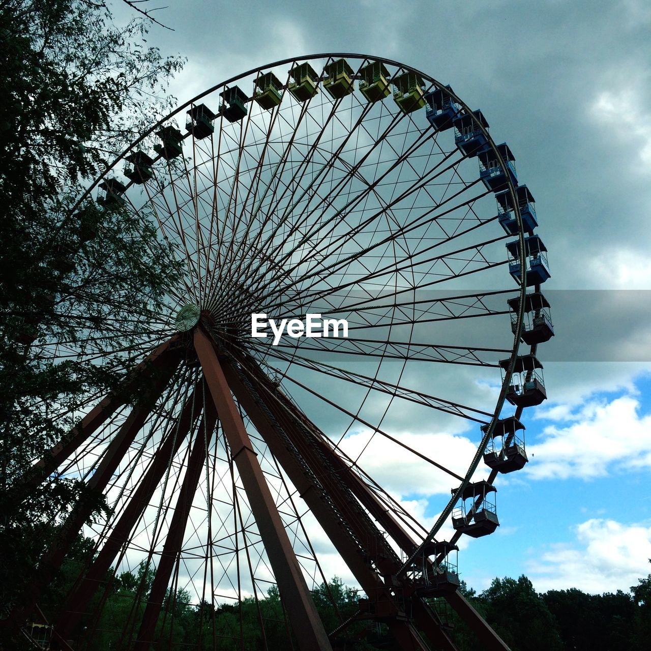 Low angle view of ferris wheel against sky