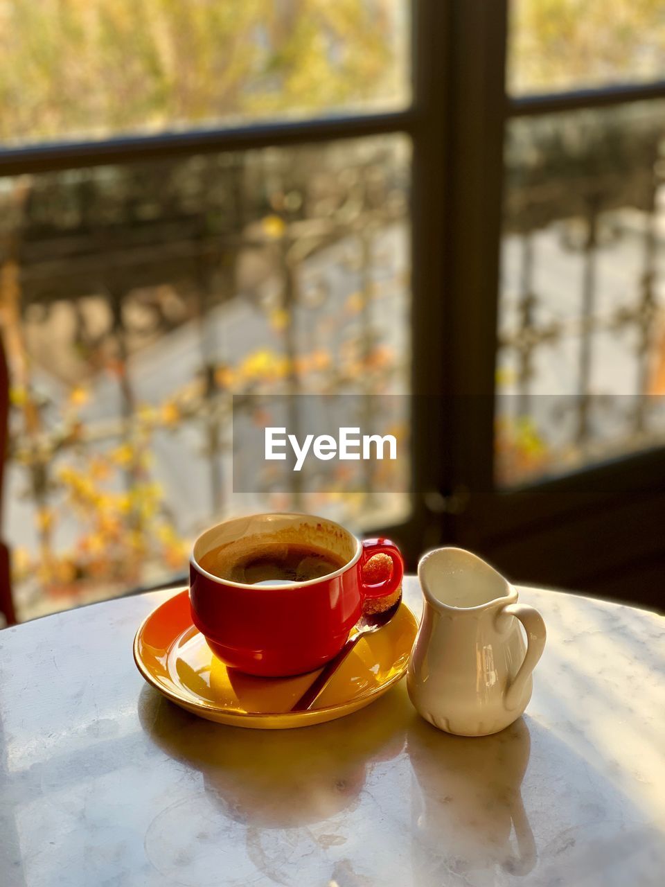 CUP OF COFFEE WITH TEA ON TABLE