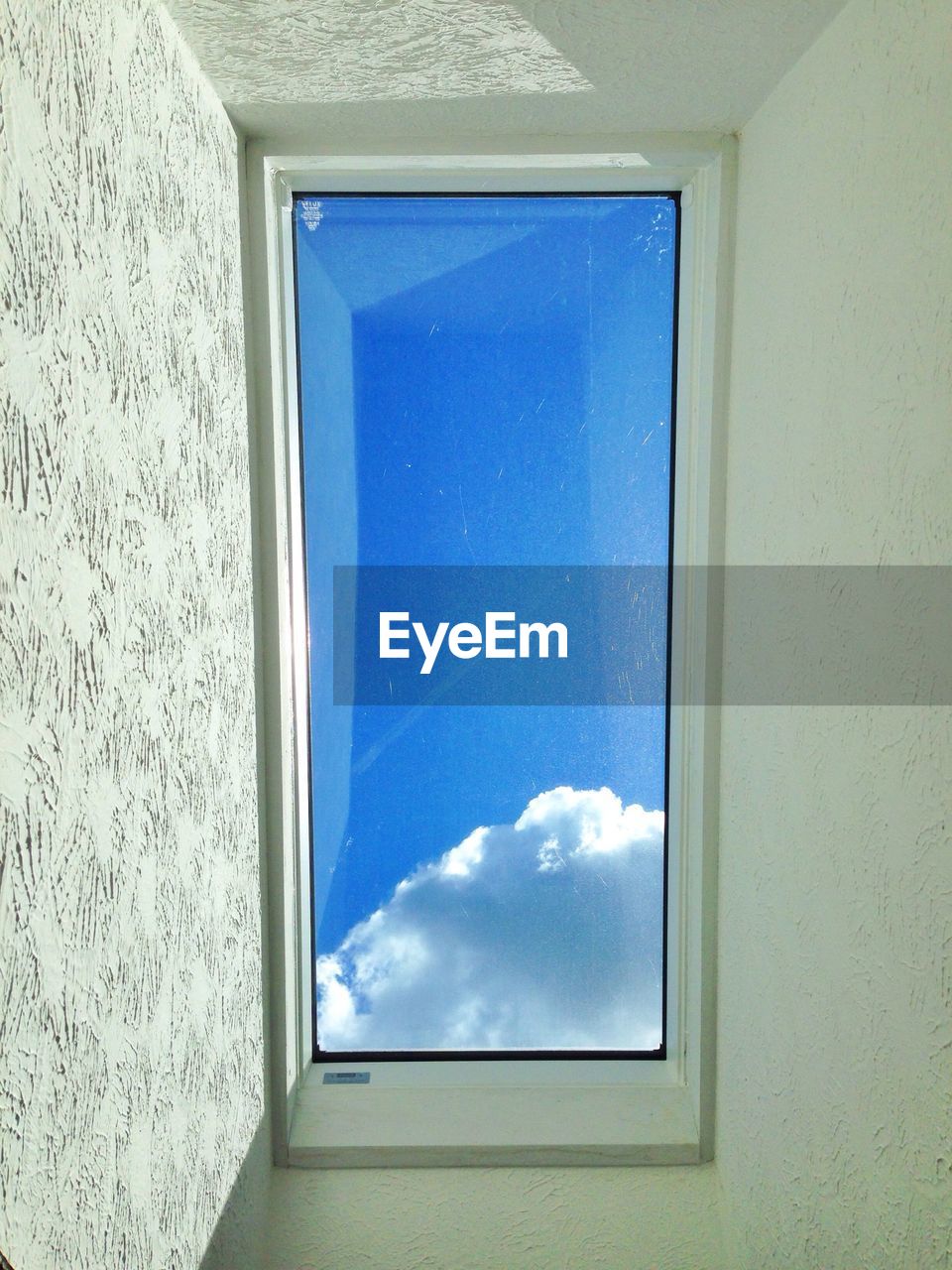 Blue sky seen through window