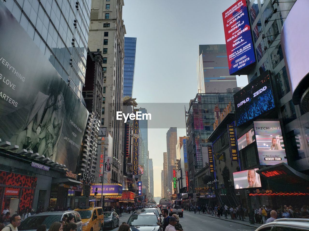 City street and modern buildings against sky